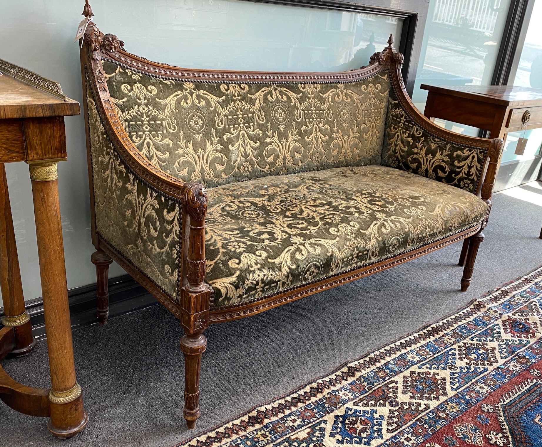 A continental carved walnut settee, length 128cm, depth 54cm, height 90cm